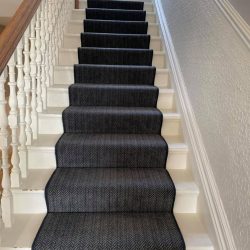 Dark grey patterned stair runner installed in Consett