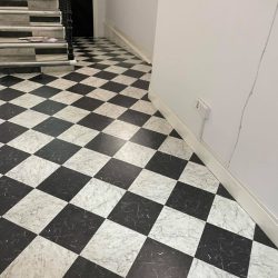 Chess style vinyl flooring installed in a apartment hallway in Consett
