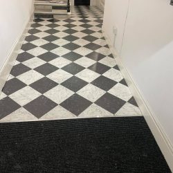 Chess style vinyl flooring installed in the entrance of an apartment in Consett