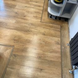 Kitchen fitted with wood effect LVT Flooring and border