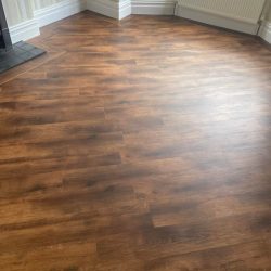 Dark wood effect LVT Flooring fitted in a lounge in Consett