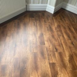 Dark wood LVT Flooring with a border fitted in a lounge in Consett