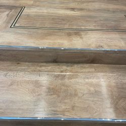 Close up of LVT steps with metal stair nosing