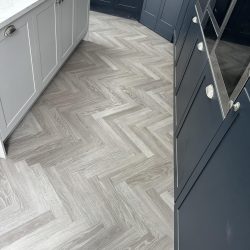 Herringbone floor fitted in a blue kitchen in Consett